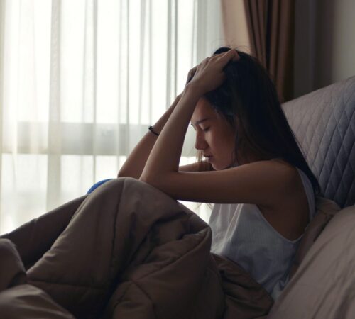 074577654-asian-woman-suffering-depressi