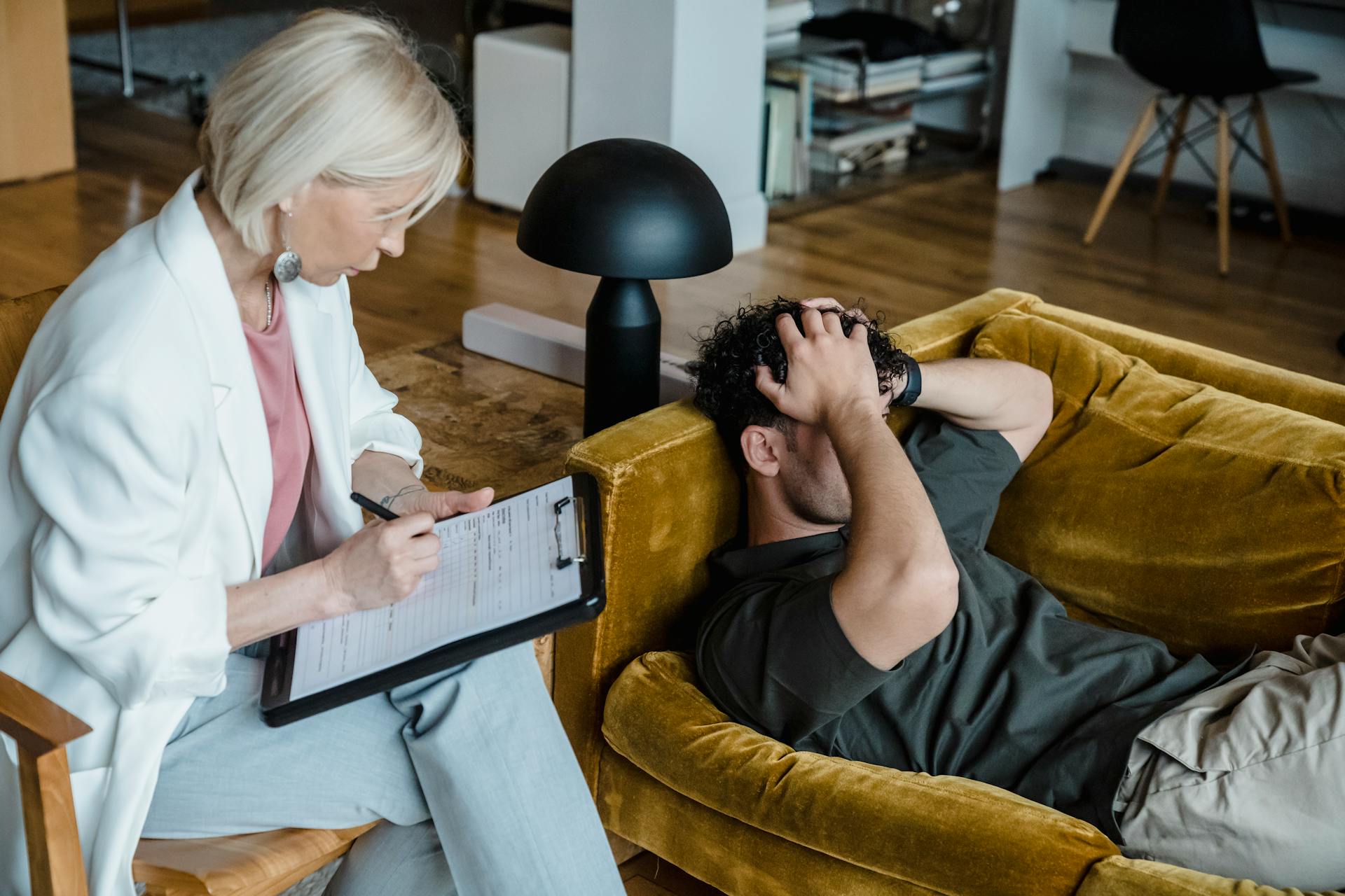 Therapist providing compassionate trauma treatment to an adult patient